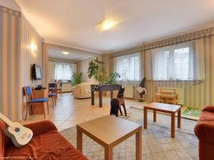 a living room with a dog standing in a room at Rezydencja Karnat I i II in Karpacz