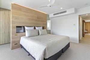 Postel nebo postele na pokoji v ubytování La Mer Apartment #10