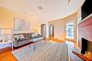 a living room with a couch and a fireplace at Charming Hillcrest Craftsman in San Diego