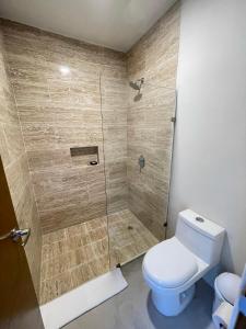 a bathroom with a toilet and a shower at The Reserve Tulum in Tulum