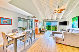 a living room with a table and chairs at Groundswell 4 Bedroom in Newport Beach