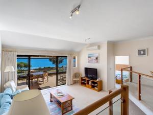 a living room with a view of the ocean at A Yachtsmans Rest, Unit 4/37 Victoria Parade in Nelson Bay