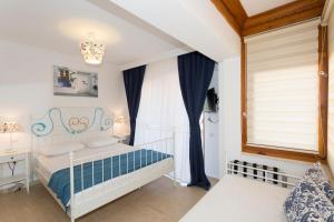 Postel nebo postele na pokoji v ubytování Ayka Hotel