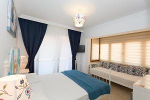 Postel nebo postele na pokoji v ubytování Ayka Hotel