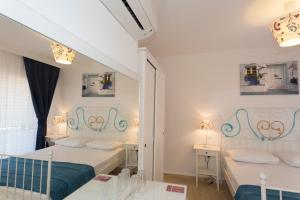 Postel nebo postele na pokoji v ubytování Ayka Hotel