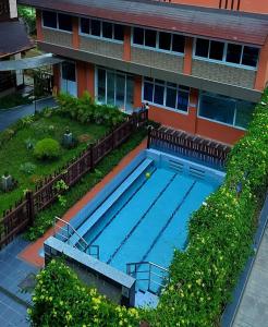 an overhead view of a swimming pool in front of a building at Immana Grand Inle Hotel in Nyaungshwe Township