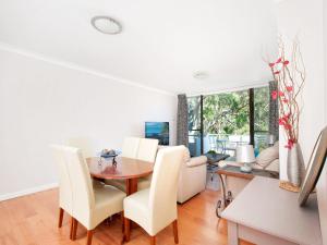 a dining room with a table and chairs at Mistral Court Unit 16 17 Mistral Close in Nelson Bay