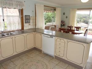 a kitchen with a sink and a counter top at Pacific Drive 89 in Fingal Bay
