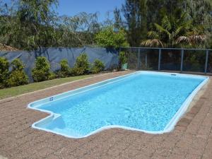 a swimming pool in a yard at Portside Unit 12 1 Donald Street in Nelson Bay