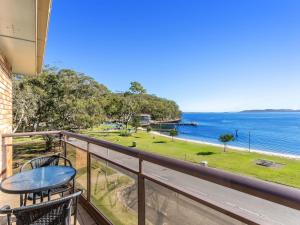 a balcony with a view of the ocean at Collendina Unit 6 19 Kurrawa Close in Nelson Bay