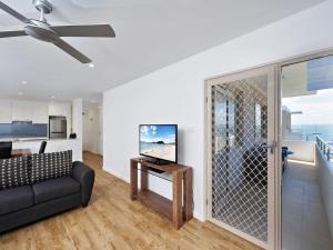 A television and/or entertainment center at Shoal Bay Road, Del Rae, Unit 18, 25