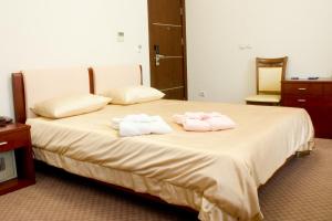 Кровать или кровати в номере Отель Афалина