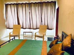 Enliven Homestay Alibag, Alibaug客房内的一张或多张床位