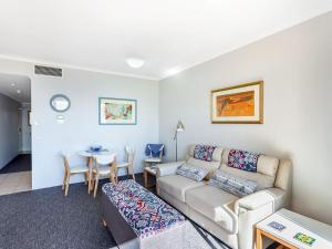 A seating area at Whitesands, Unit 113/41-45 Shoal Bay Road