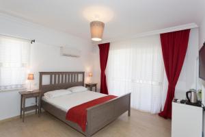 Postel nebo postele na pokoji v ubytování Ayka Hotel