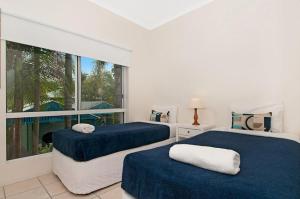 Postel nebo postele na pokoji v ubytování Clearwater Noosa Resort