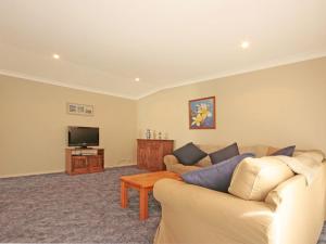 a living room with a couch and a tv at Bring the Dog, Boat and Family in Burrill Lake