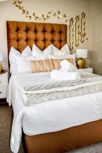 Postel nebo postele na pokoji v ubytování Palm Valley Inn - Port Elizabeth