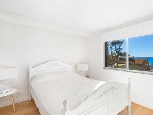 Ένα ή περισσότερα κρεβάτια σε δωμάτιο στο The Shoal Apartments Unit 310