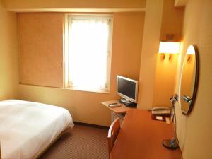 TV a/nebo společenská místnost v ubytování Smile Hotel Shiogama