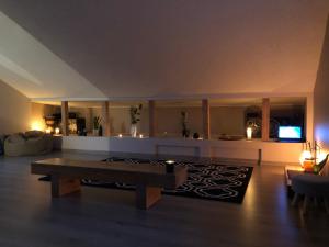 a living room with a couch and a table at Two story tiny house in Ventspils