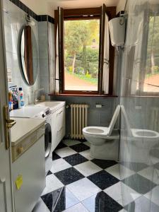 a bathroom with a sink toilet and a window at Casa dei Tramonti in San Feliciano +33 photos