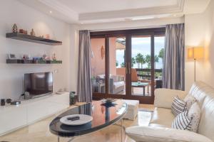 A seating area at High standard beach front apartment