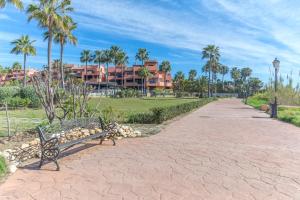 A garden outside High standard beach front apartment