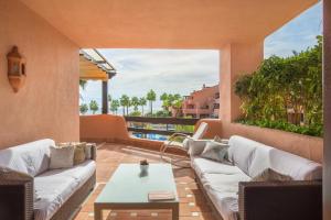 A seating area at High standard beach front apartment