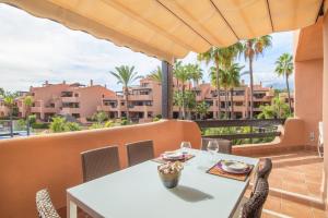 A balcony or terrace at High standard beach front apartment