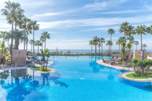 The swimming pool at or close to High standard beach front apartment