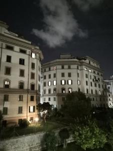 two buildings at night with the lights on at Suite 59 romeholidayhome in Rome