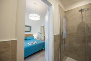Säng eller sängar i ett rum på Mamo Florence - Amalia Piazza Signoria Apartment