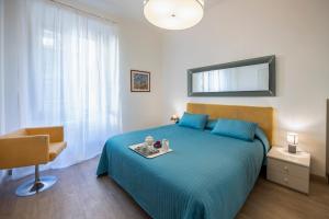 Säng eller sängar i ett rum på Mamo Florence - Amalia Piazza Signoria Apartment