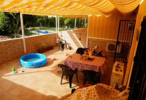 A balcony or terrace at Family friendly patio and poolview