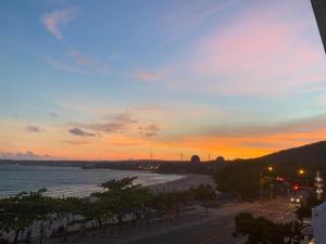 a view of a beach at sunset at 南灣陽光皮小妞 Pii hostel in Nanwan