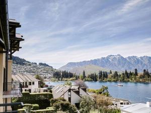 a view of a river with mountains in the background at Hotel St Moritz Queenstown - MGallery by Sofitel in Queenstown
