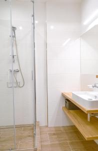 a bathroom with a shower and a sink at TATRYSTAY Apartment Sankt Bernard in Nový Smokovec