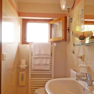 Ett badrum på Hotel San Michele