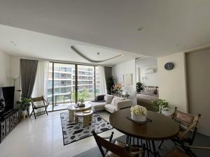 a living room with a couch and a table at Veranda Residence Hua-Hin in Hua Hin