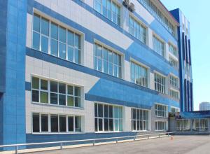 a blue and white building with a lot of windows at Uchebnaya Hotel in Vladivostok