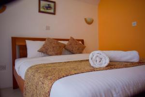 Letto o letti in una camera di Camp Mahon Gardens