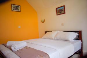 Letto o letti in una camera di Camp Mahon Gardens