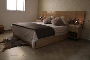 Tempat tidur dalam kamar di Tiwaline Tarsime App E