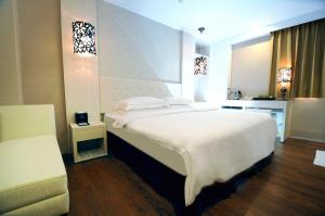 Krevet ili kreveti u jedinici u okviru objekta The Riverside Hotel Hengchun