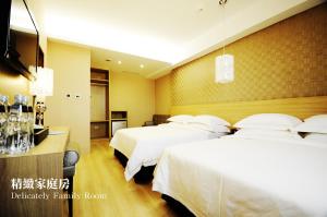 Krevet ili kreveti u jedinici u okviru objekta The Riverside Hotel Hengchun