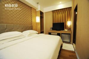 Krevet ili kreveti u jedinici u okviru objekta The Riverside Hotel Hengchun