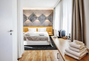 Postel nebo postele na pokoji v ubytování Seevital Hotel & SPA - Ihr 4 Sterne Superior Hideaway direkt am See