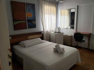 Cama ou camas em um quarto em Palace Hotel Mendoza