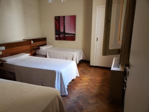 Cama ou camas em um quarto em Palace Hotel Mendoza
